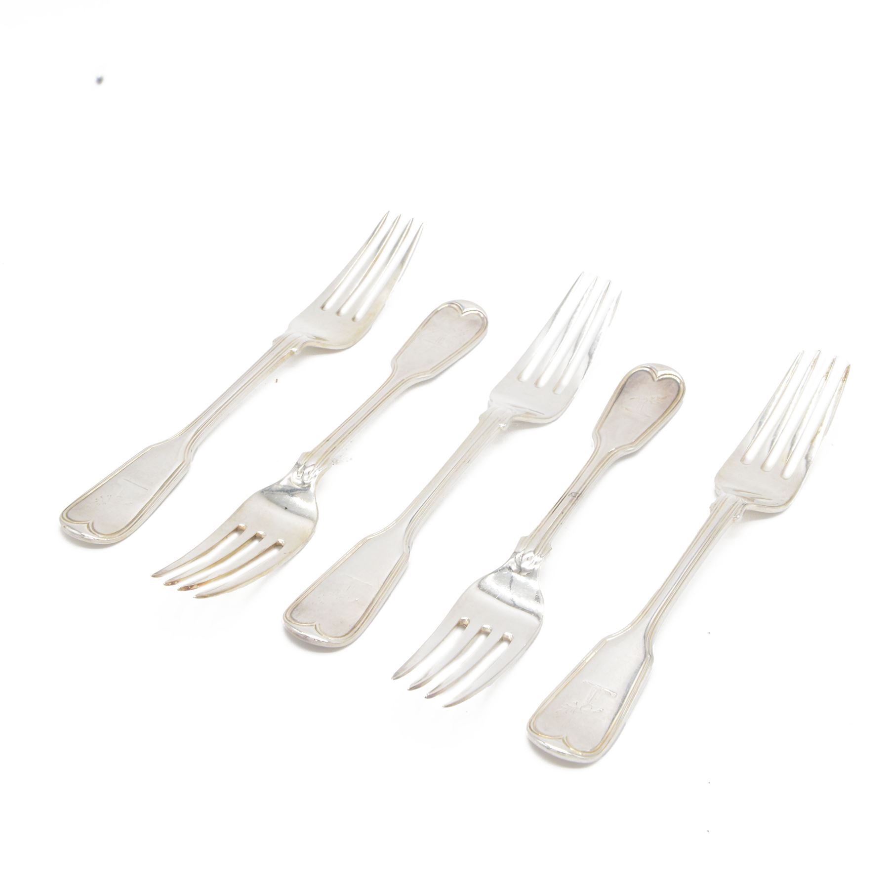 Five Victorian silver Fiddle pattern table forks, all engraved with crest to terminal, hallmarked The Portland Co, London 1861