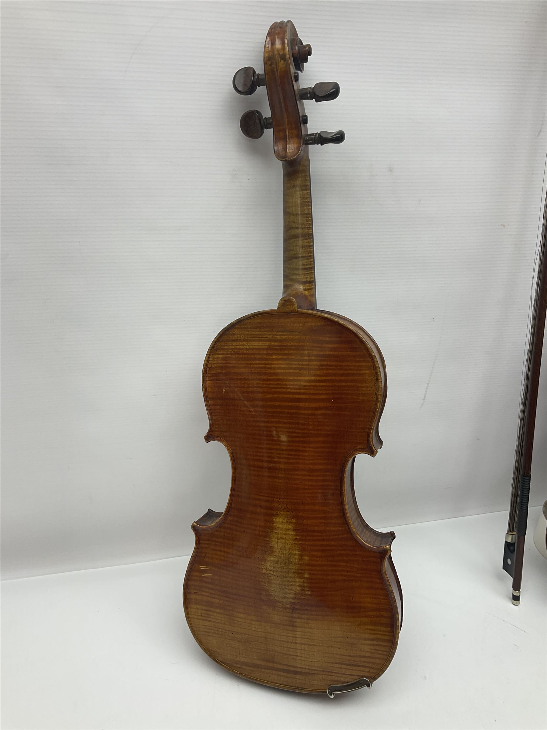 German trade violin in the Steiner style c1900 with 35.5cm two-piece maple back and ribs and spruce top L59cm overall; in fitted carrying case with two bows; and a Saxony violin with 35.5cm one-piece maple back and ribs and spruce top L58.5cm overall (2)