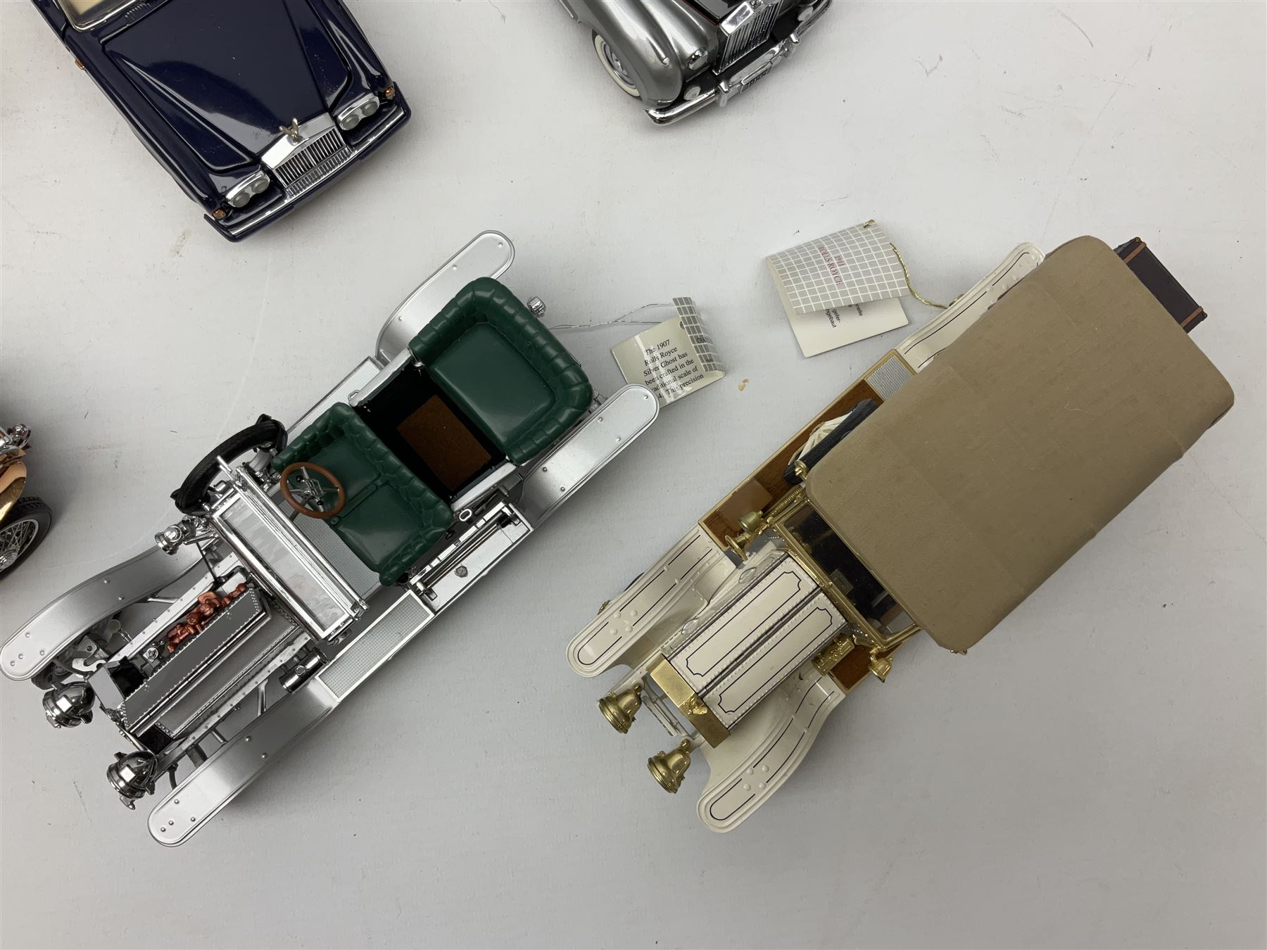 Eight Franklin Mint diecast models of cars, 1911 Rolls-Royce Tourer, The Rolls-Royce Corniche IV, The Mercedes Simplex, 1955 Rolls-Royce Silver Cloud, 1921 Rolls-Royce Silver Ghost, 1907 Rolls-Royce Silver ghost,1929 Rolls-Royce Phantom I,  and 1930 V-16 452 Cadillac Imperial Sedan, all with original tags attached