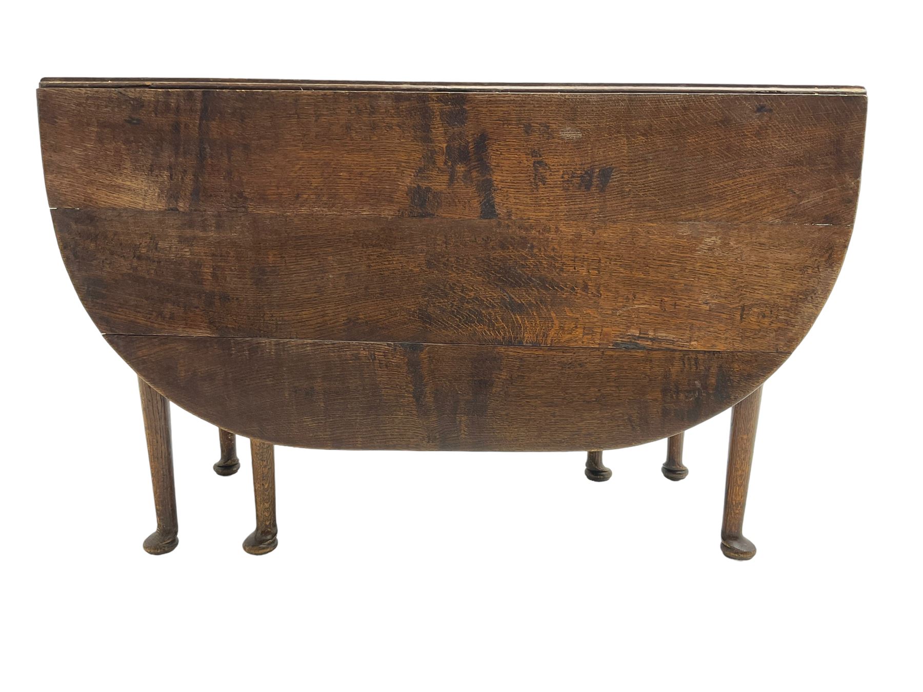 George III oak drop-leaf dining table, oval top over gate-leg action cabriole supports