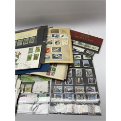Great British and World stamps in albums and loose including Canada, Ceylon, Denmark, France, Nigeria etc and various Queen Elizabeth II mint stamps in presentation packs, face value of useable postage approximately 30 GBP 