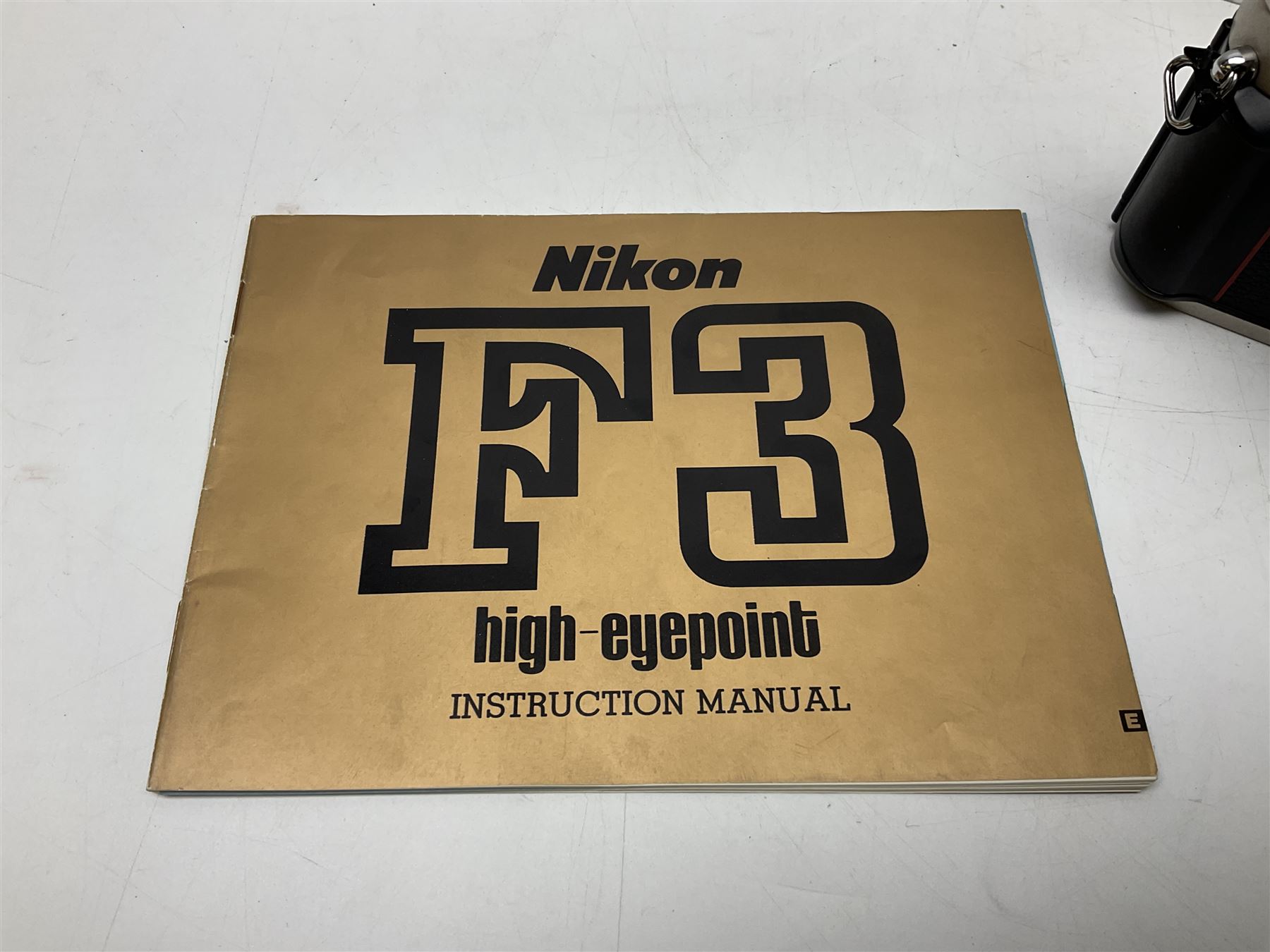 Nikon F3T camera body, in champagne/ titanium colourway, serial no. T8215031, with 'Nikon Nikkor 50mm 1:1.4' lens, Nikon MD4 motor drive, serial no. 156592 and Nikon MK-1 Firing range converter, all with original boxes 