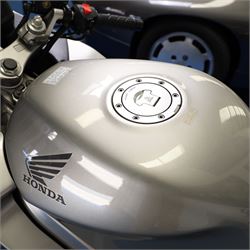 1998 Honda VFR800 FI Sports Touring Motorcycle

• Registration: R145 SUT
• Date of first registration: 1998
• Engine: 781cc V4 petrol
• Fuel system: Honda PGM-FI fuel injection
• Transmission: Manual
• Odometer reading: 11,700 miles
• Colour: Silver with black trim
• V5C: Present
• Keys: Two
• Security: Datatag immobiliser

A well-presented 1998 Honda VFR800 FI sports touring motorcycle, finished in silver with contrasting black trim and displaying a notably low odometer reading of 11,700 miles.

The VFR800 combines Honda’s renowned V4 engine with PGM-FI fuel injection and a combined braking system, creating a capable and refined motorcycle suited to both sporting and long-distance use.

Features include:

• Full factory fairing
• Tinted windscreen
• Honda PGM-FI fuel injection
• Combined braking system
• Twin front brake discs
• Factory exhaust system
• Alloy wheels
• Rear passenger grab handles
• Datatag immobiliser
• Digital instrument display

The motorcycle appears complete and largely original and has been stored indoors. It is presented in good overall condition, with light cosmetic marks consistent with its age and use.

This vehicle forms part of the Estate of the Late John Sils and is offered for sale by the Executors, confirming a genuine reason for sale.
