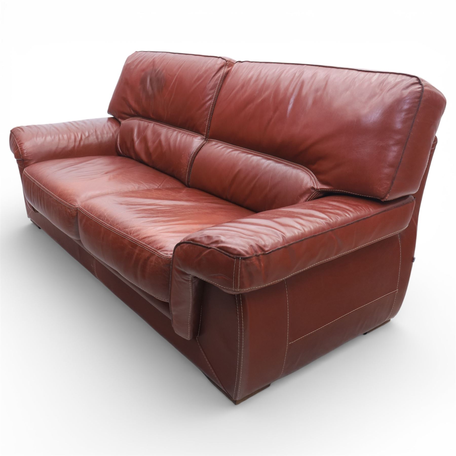 Fabrizio Mantellassi - 20th century Italian red leather suite, one three seat and two large armchairs, upholstered in deep red hide with stitched seam detailing, with magazine pockets to each side, the rectangular back cushions above broad padded arms and seat cushions, raised on low block bases

Sofa: H c98m, W 203cm, D 92cm
Armchair: H 98cm, W 113cm, D 92cm