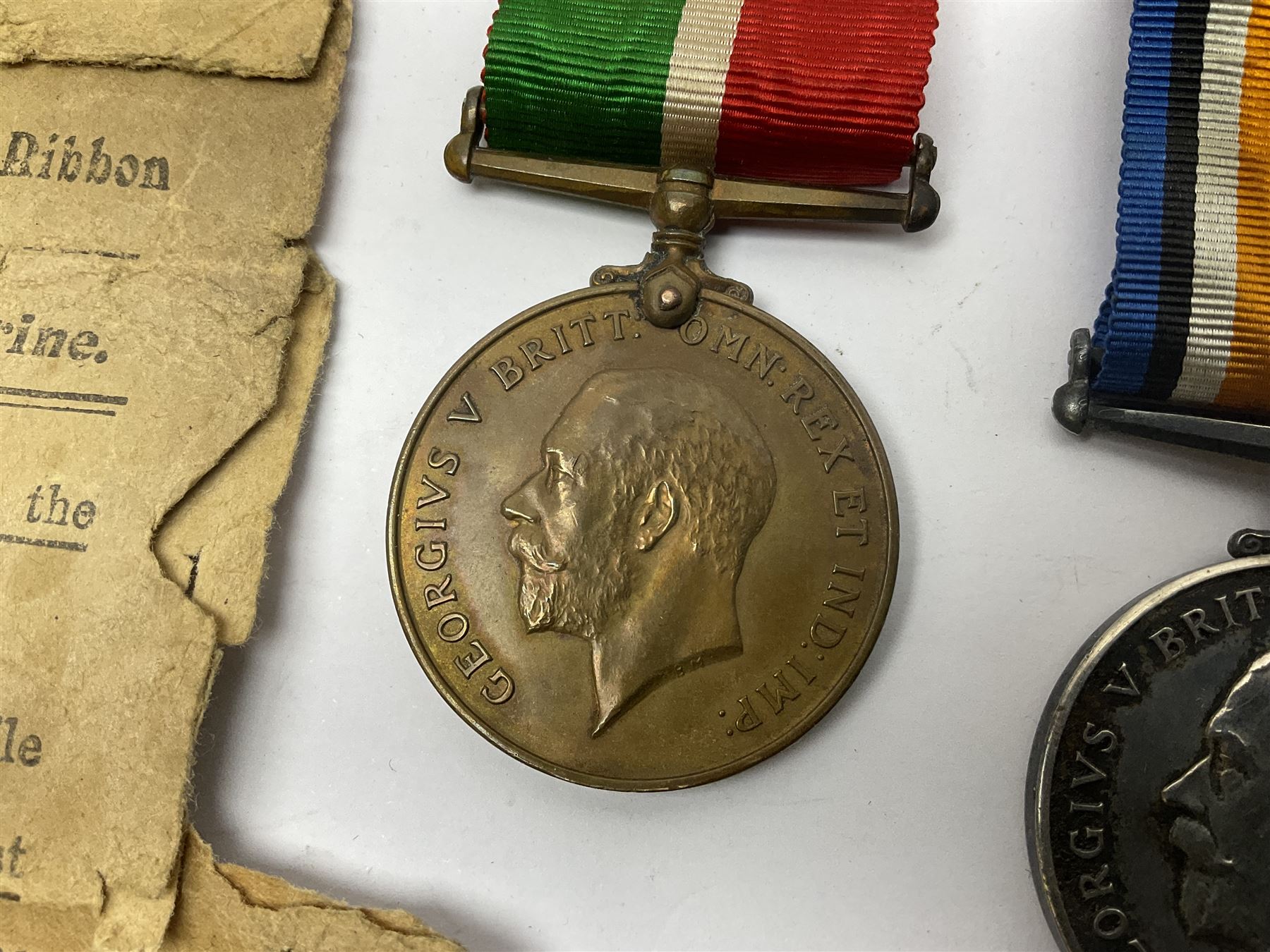 WWI pair of medals comprising Mercantile Marine medal and British War medal, awarded to Dominic L Kelly; both with ribbons and part original packaging and a Victoria Diamond Jubilee medallion.