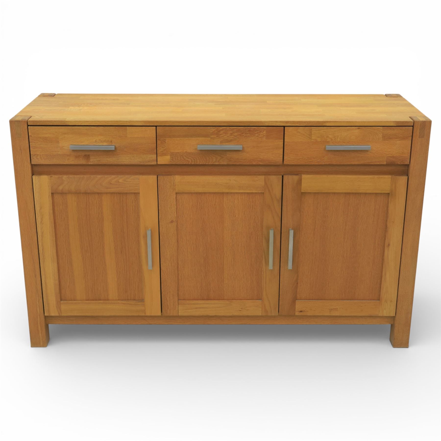 Solid light oak sideboard, fitted with three drawers and three cupboards
