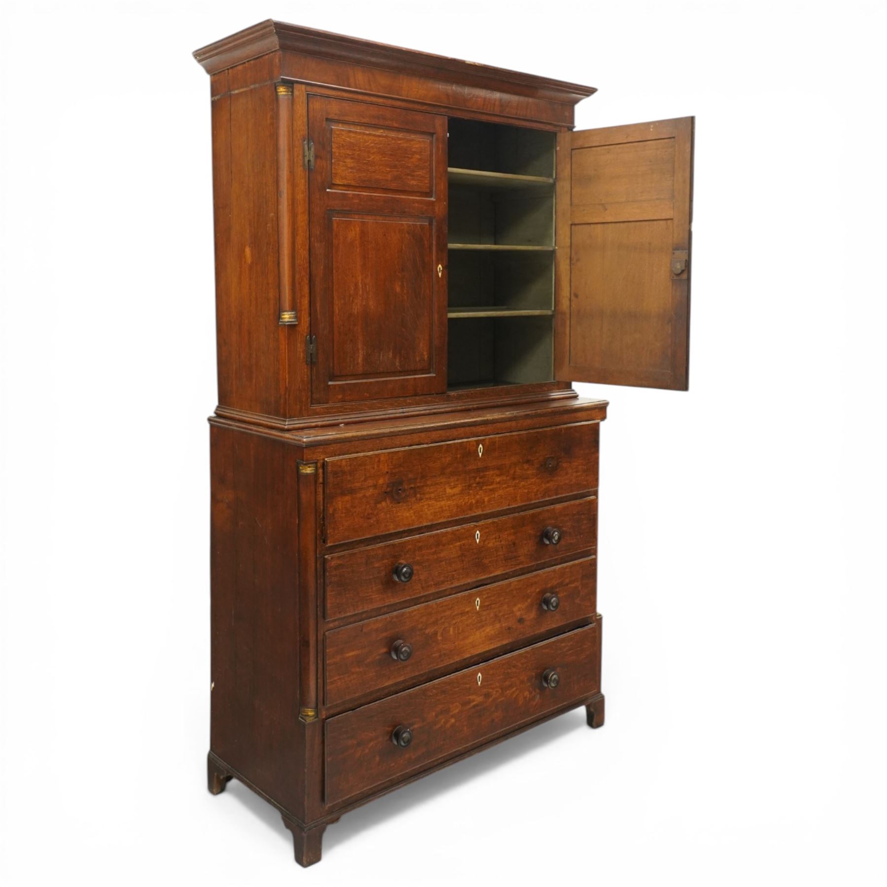 George III oak and mahogany bound enclosed bookcase-secretaire, panelled cupboards over four drawers