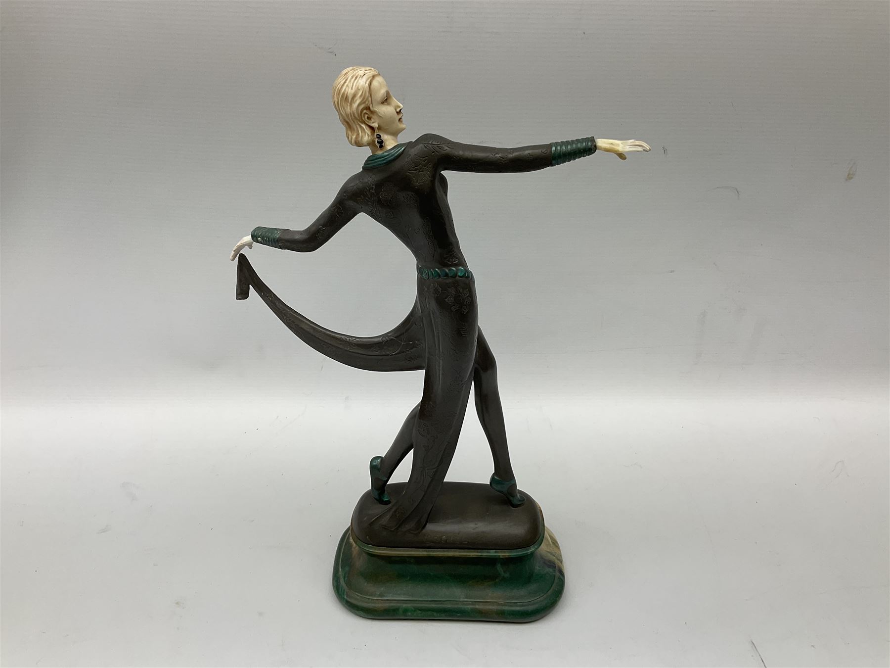 Art Deco style bronze, after Josef Lorenzl, modelled as a dancing lady with outstretched arms, with resin head and hands, raised upon marble effect base, signed to base, H38cm