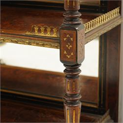 Fine late 19th century Aesthetic Movement ebony and amboyna cabinet on stand with parcel-gilt detail, the moulded cornice with pierced gilt-brass three-quarter gallery above a pair of panelled doors centred by oval porcelain portrait plaques within gilt-metal ribbon-tied frames, the doors further enriched with gilt-metal foliate mounts and flanked by classical figural terms, enclosing a shelved interior, the projecting lower section with amboyna top above a frieze drawer set with a series of floral porcelain roundels within pierced gilt-metal mounts and a central oval floral plaque, raised on turned and fluted supports with gilt-heightened detail, the mirrored back behind two amboyna shelves with pierced gilt-brass galleries, on turned feet