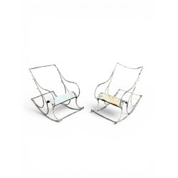Pair of white painted cast metal garden chairs, ornate reclined backs, circular pierced seats on cabriole legs