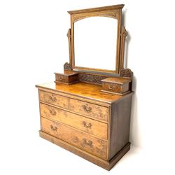 Edwardian walnut dressing chest, raised swing mirror back, two trinket drawers above two short and two long drawers, platform base