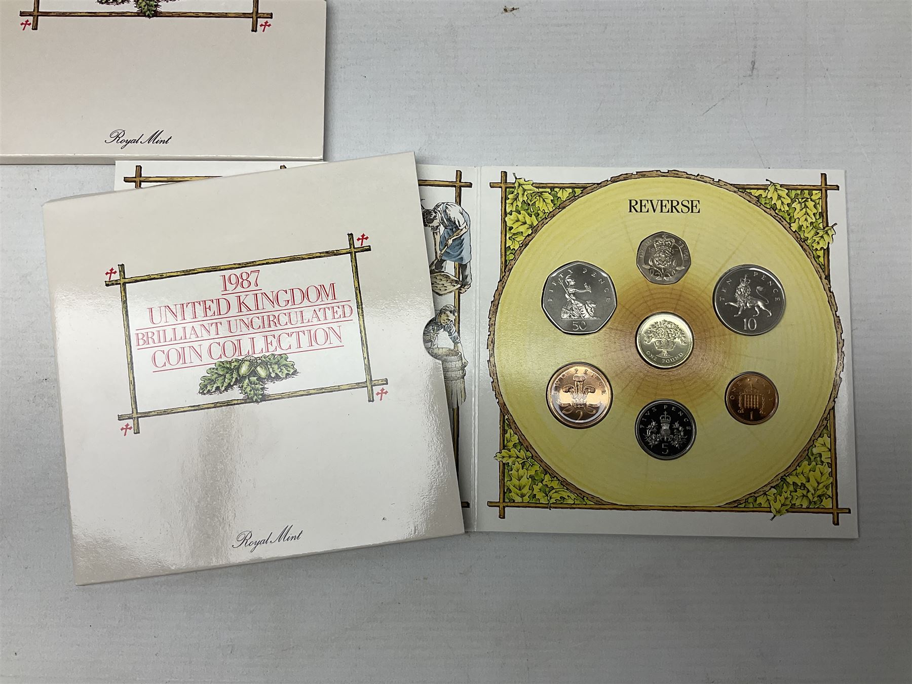 Thirteen The Royal Mint United Kingdom brilliant uncirculated coin collection dated two 1985, two 1986, two 1987, 1988, two 1989, two 1990, two 1991, all in card folders