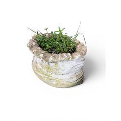 Four cast stone garden planters in the form of ribbon tied planting sacks