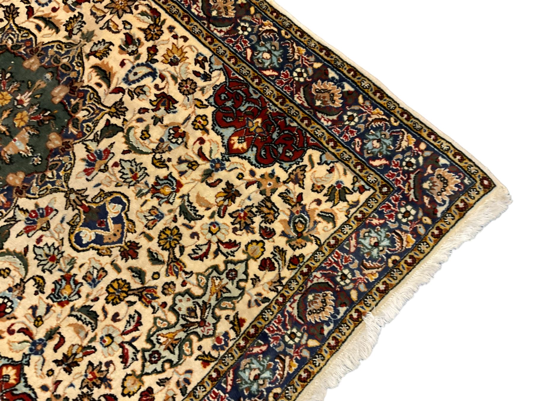 Persian ivory ground rug, central green floral pole medallion within a field decorated by scrolling foliate patterns, the guarded border with repeating palmettes and floral designs