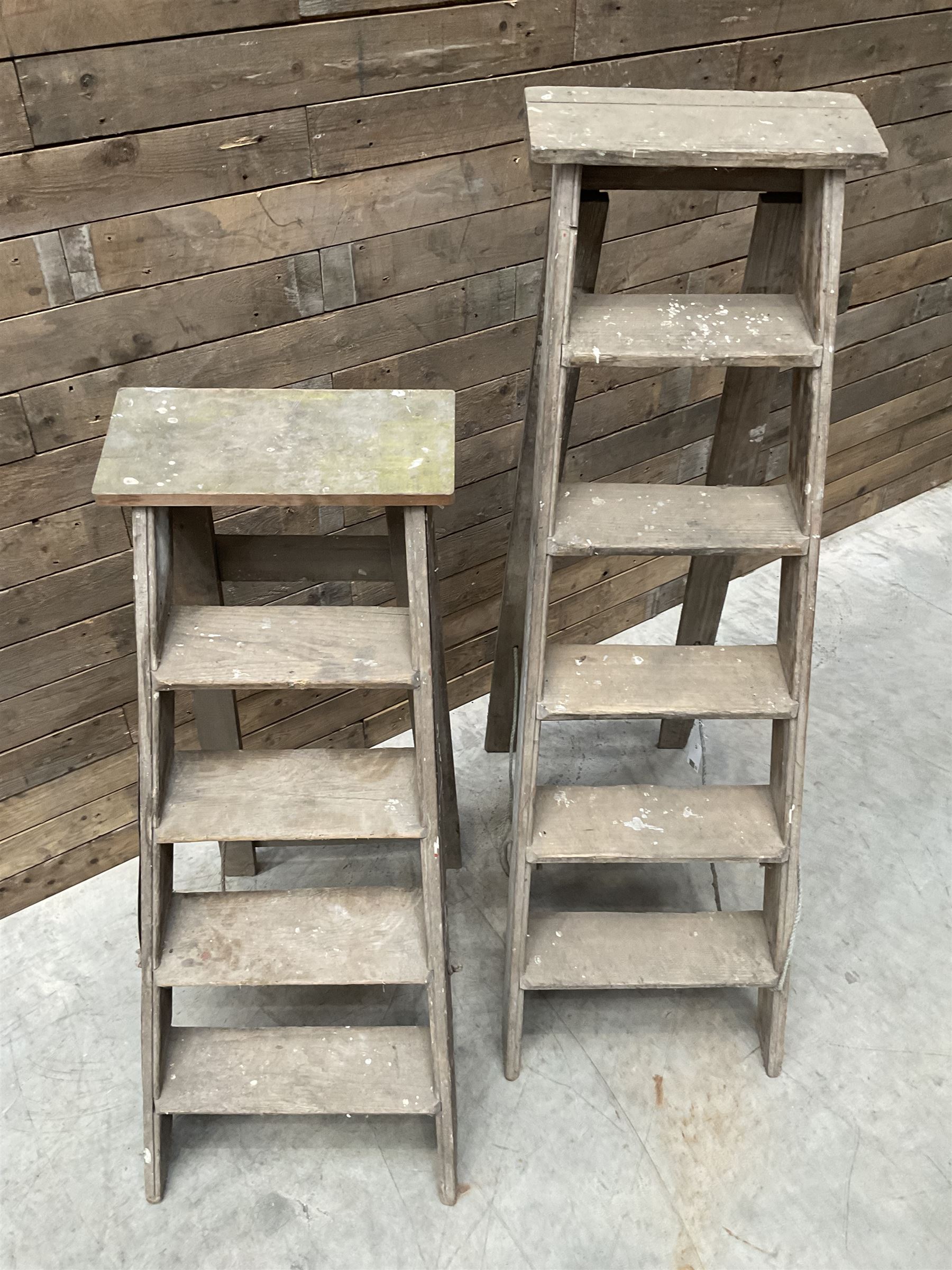Two antique wooden step ladders, H100cm and 140cm