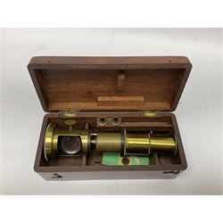 Victorian student's travelling brass monocular microscope H15cm; in fitted mahogany case with two additional lenses and one slide
