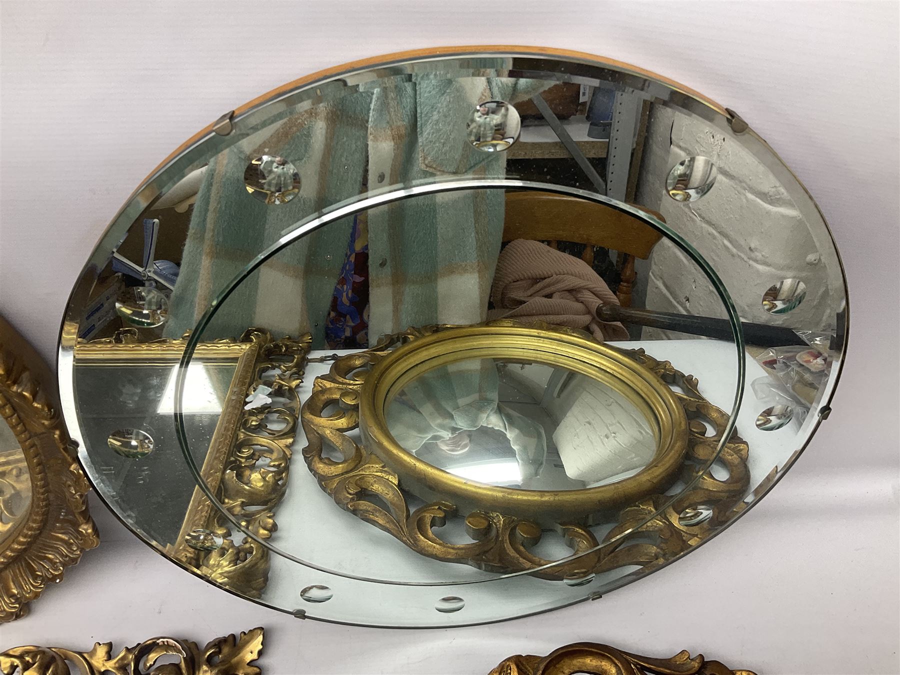 Three Rocco style gilt mirrors, together with another mirror, largest example H64cm 
