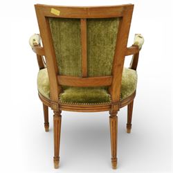 French Louis XVI style walnut armchairs, rectangular upholstered backs with nailhead trim, padded seats upholstered en suite, out-swept arms with upholstered pads, fluted supports with carved rosettes to the knees, on turned and fluted tapering legs