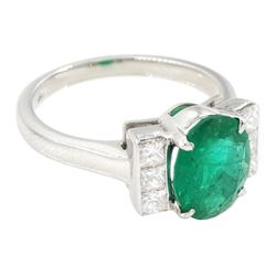 18ct white gold emerald and diamond ring, single oval cut emerald, each side set with three princess cut diamonds, stamped 750, emerald approx 1.90 carat, total diamond weight approx 0.50 carat