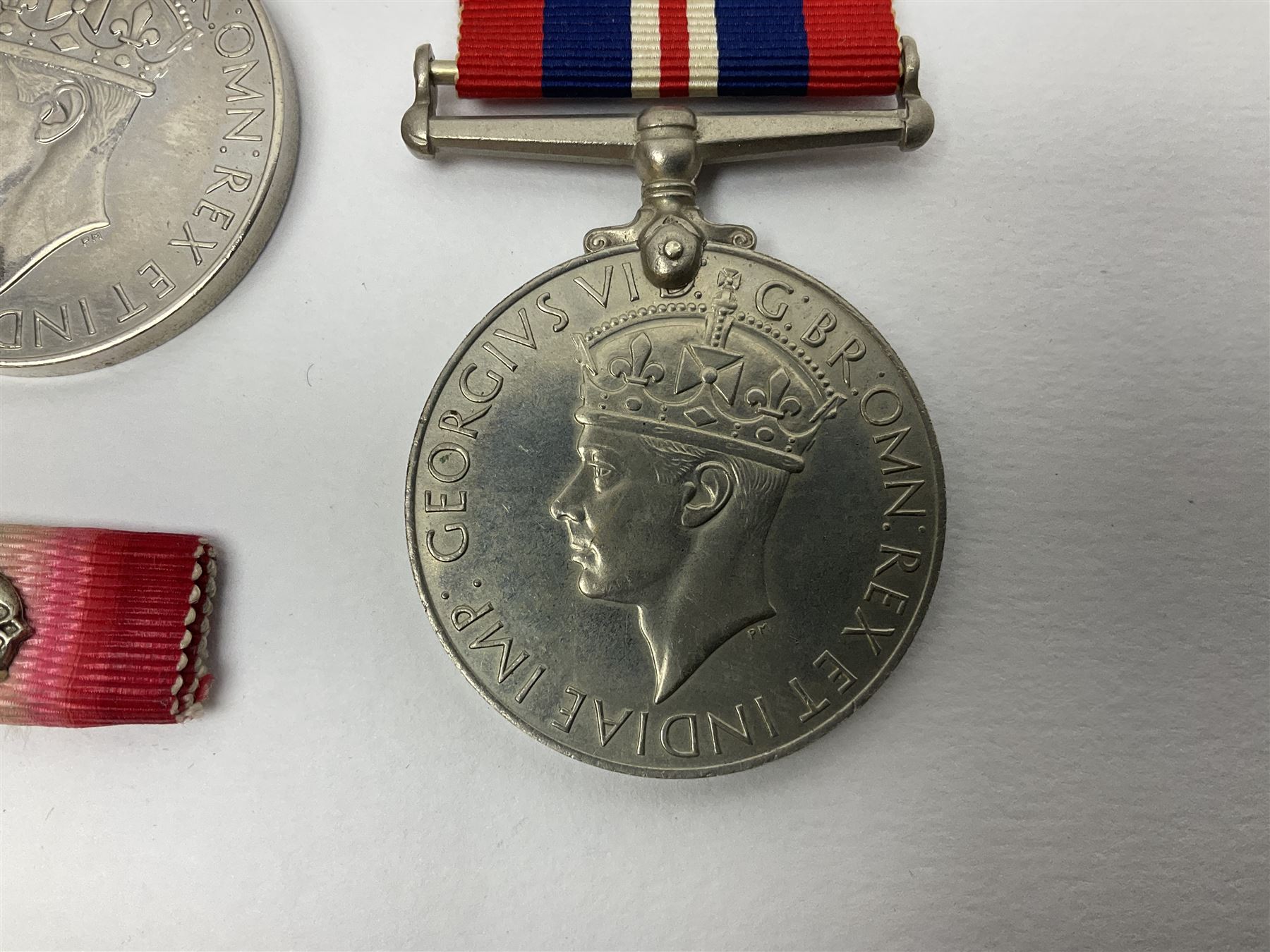 WW1 group of three medals comprising British War Medal, Victory Medal and 1914 Star awarded to 8328 Pte. G. Shaw Yorks: L.I.; on hanging bar with WW2 1939-1945 War Medal and WW1 ribbon bar with rosette to 1914 Star ; all with ribbons; and WW2 1939-1945 War Medal with ribbon