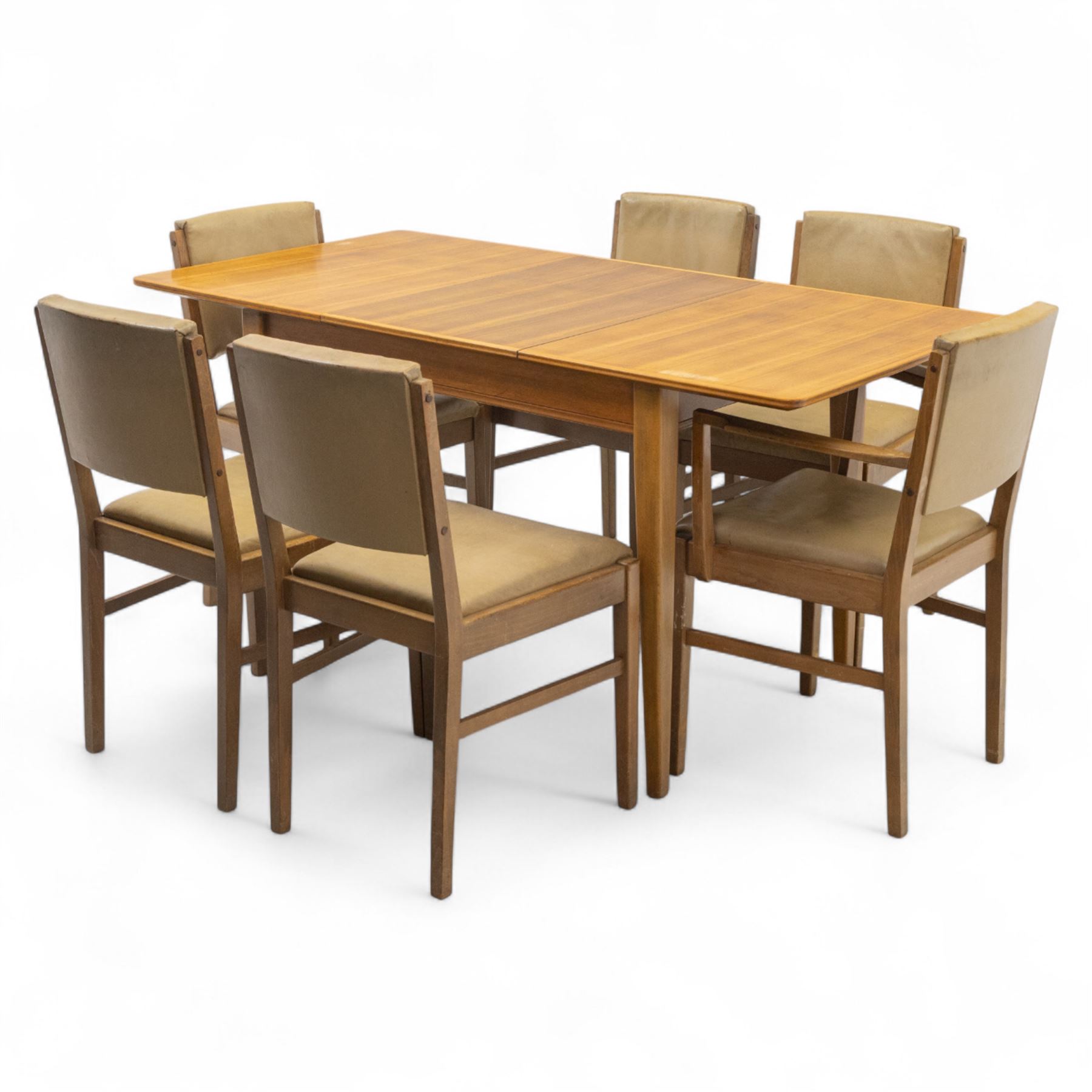 Gordon Russell - mid 20th century teak dining suite, comprising rectangular extending dining table and six matching chairs including one carver, each chair with padded upholstered seat and backrest in vinyl, on square supports, the table with plain top and rounded edges on tapered legs, an example of the firm’s functional post-war design with restrained modernist detailing (Chairs H 85cm, W 47cm, D 46cm) (Extends to 154cm)