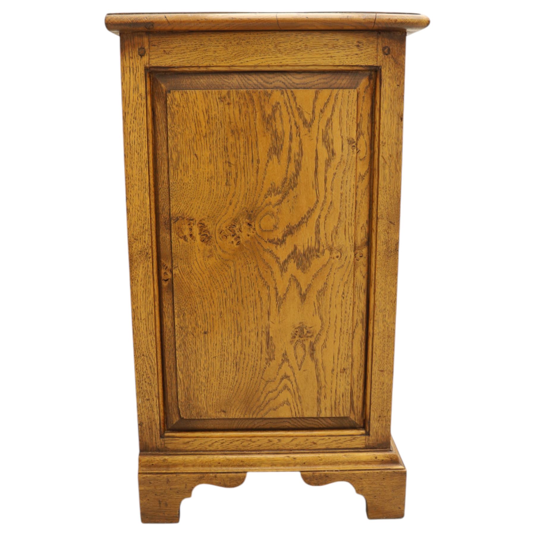 Small 20th century burr oak chest, the figured top over three graduated drawers with moulded fronts and pierced brass handles, on shaped feet