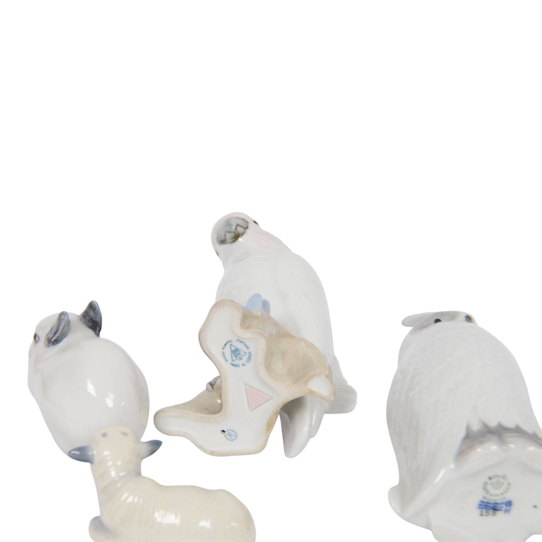 Royal Copenhagen, five figures including Owl 155, Snowman 017, Rabbit 154 etc, together with Royal Dux cockatoo