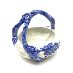 A late Victorian Royal Worcester blue and white basket, modelled as a birds nest with naturalistically modelled vine handle, with impressed mark beneath, D17cm. 
