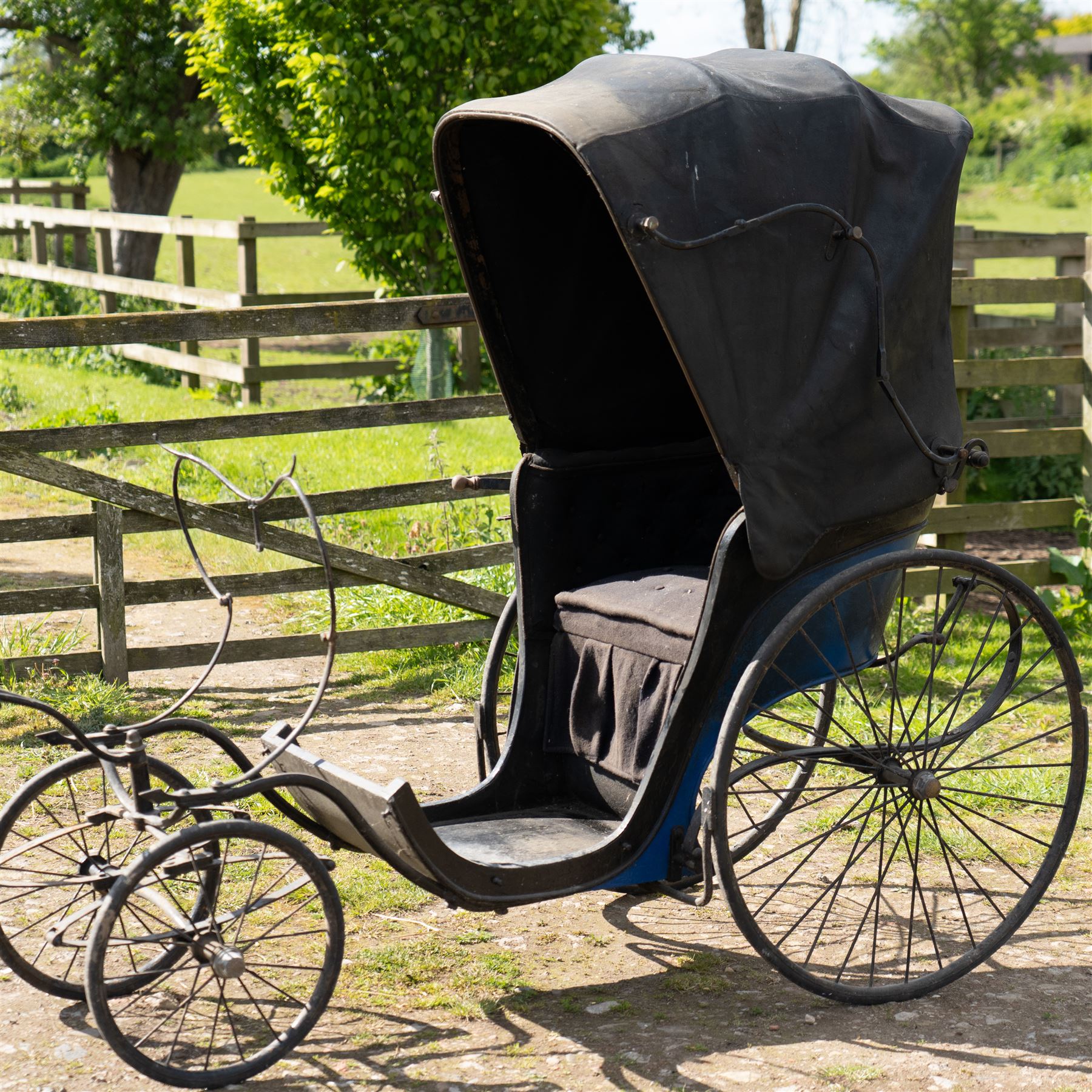 Victorian Bath Chair / Invalid Carriage Converted for Horse Drawn Use

A Victorian bath chair or invalid carriage, later converted for horse drawn use, with black painted bodywork, blue side panels, folding black leather hood and upholstered single passenger seat. The carriage is fitted with large rear wire spoked wheels, smaller front steering wheels, long shafts, footwell and curved body sides, consistent with a late nineteenth century invalid carriage or bath chair form adapted for pony or light horse use.

Features

Bath chair or invalid carriage form
Later converted for horse drawn use
Folding black leather hood
Single upholstered passenger seat
Deep footwell
Black painted body with blue side panels
Large rear wire spoked wheels
Smaller front steering wheels
Long shafts
Lightweight carriage frame

Dimensions:
Overall length: 380 cm
Body length: 204 cm
Width: 88 cm
Height: 178 cm

Wheel Diameters:
Front wheels: 47 cm
Rear wheels: 88 cm

Seating:
Driver: 1
Passenger: None