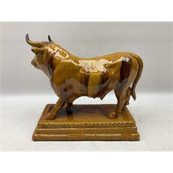 M Mafra Caldas, figure in the form of a bull upon a stepped rectangular base, with an impressed mark beneath, H36cm   
