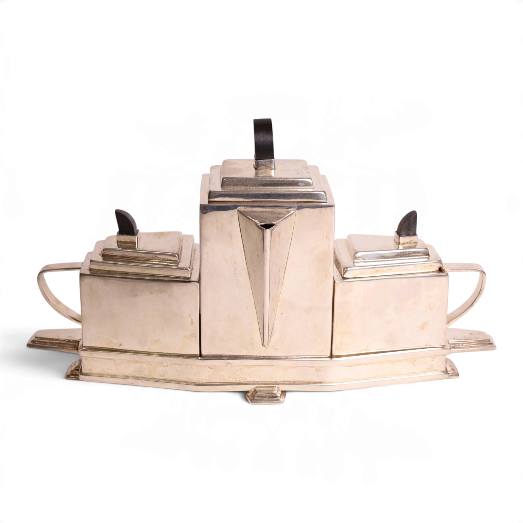 Art Deco silver plated tea set, in the manner of Christopher Dresser, within a fitted tray H23cm