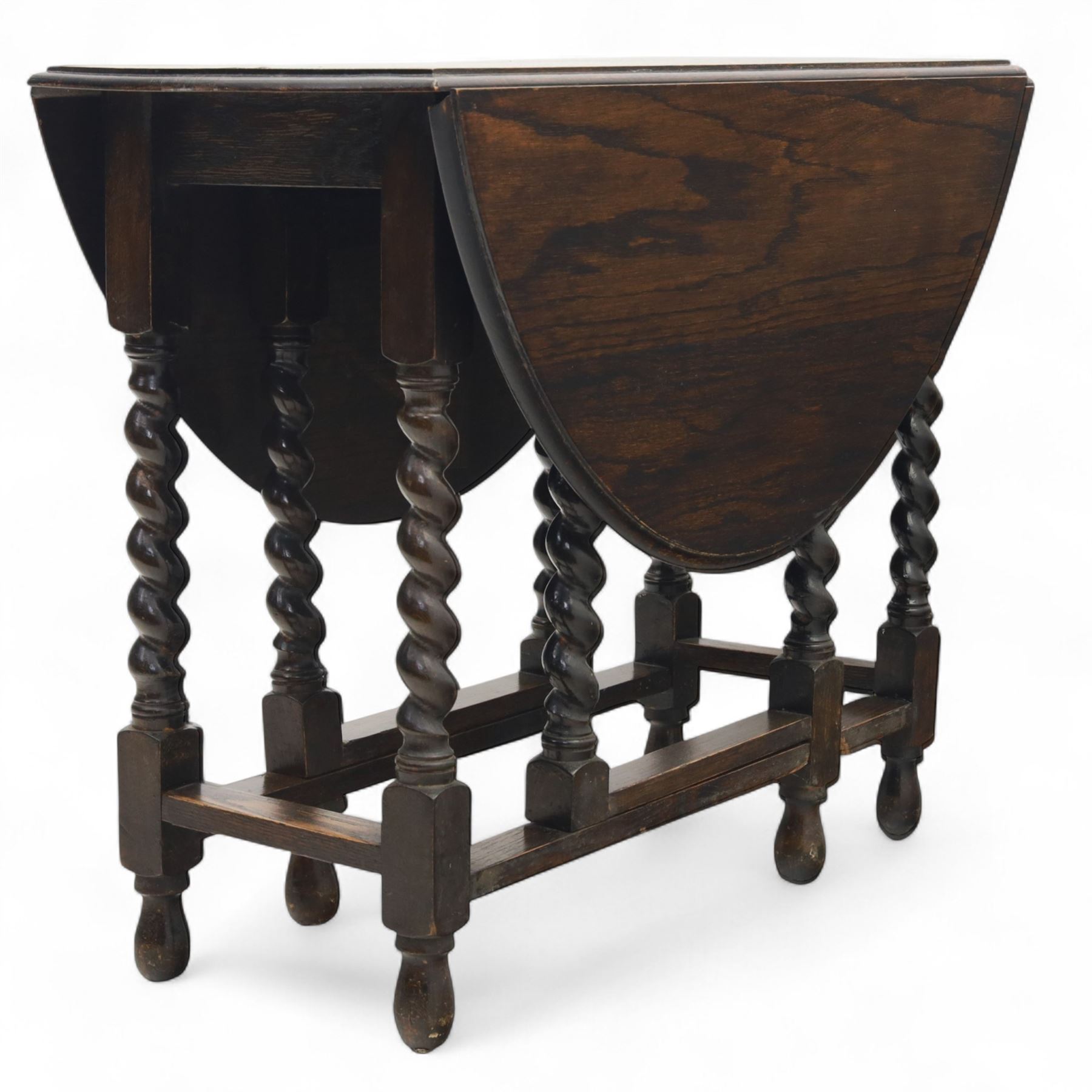 20th century oak gateleg table, with oval fold-out top supported on turned barley twist legs and stretchers (Extended 116cm)