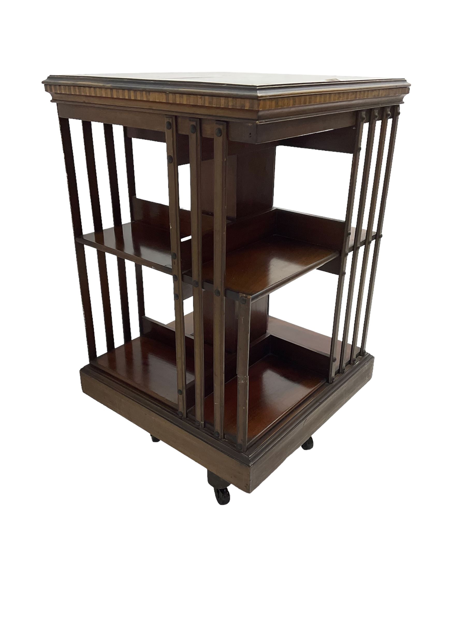 Maple & Co. London - Edwardian mahogany inlaid revolving bookcase, moulded square top with inlaid circular fan motif and satinwood banding, with circular label