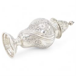 Edwardian silver sugar caster, of typical form embossed with floral decoration, the removable pierced cover with oblique gadrooned rim and bud finial, upon a circular stepped foot, hallmarked Hawksworth, Eyre & Co Ltd, London 1901, H20cm
