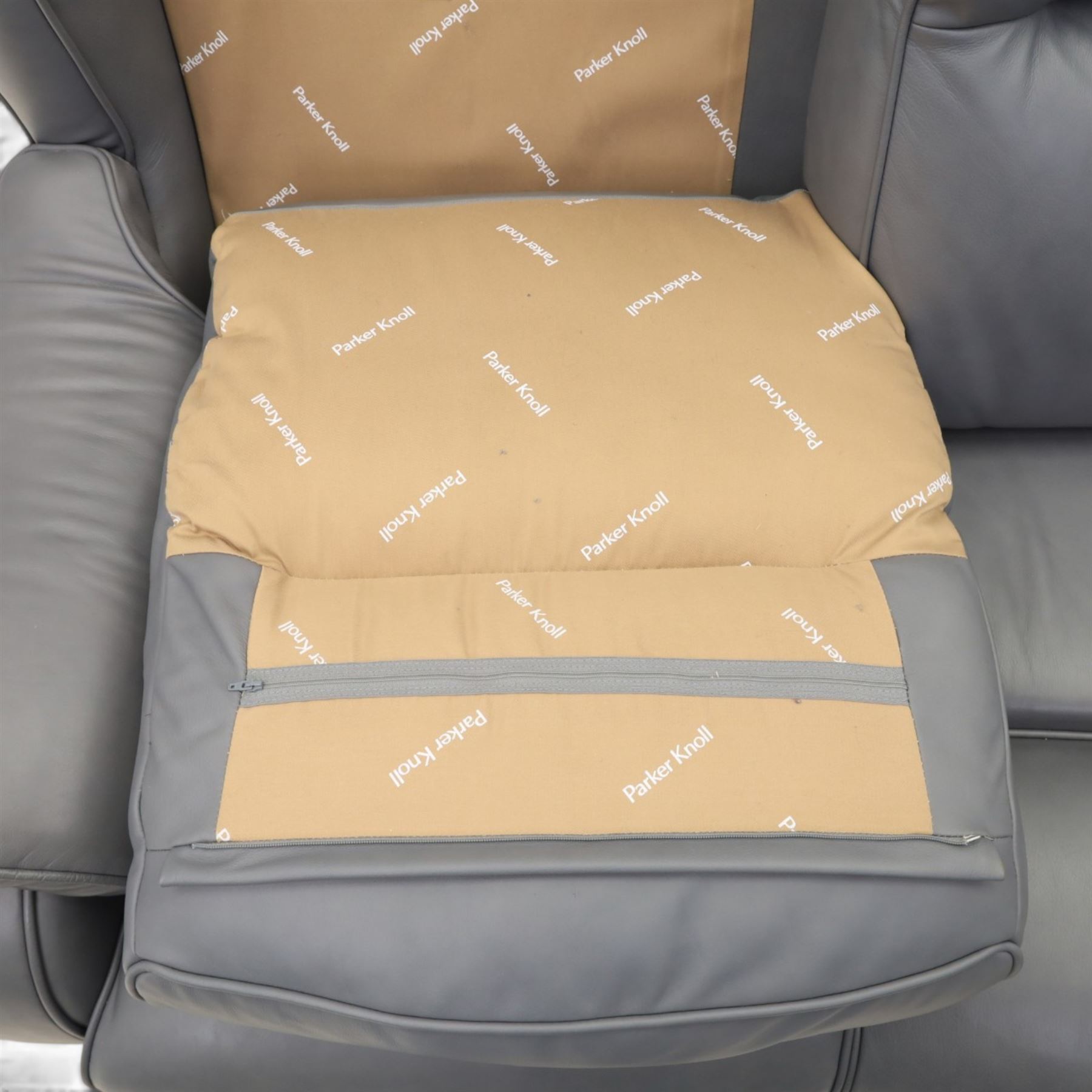 Parker Knoll - 'Boston' grey leather two seater sofa, with zip in cushions and shaped arms, raised on dark feet