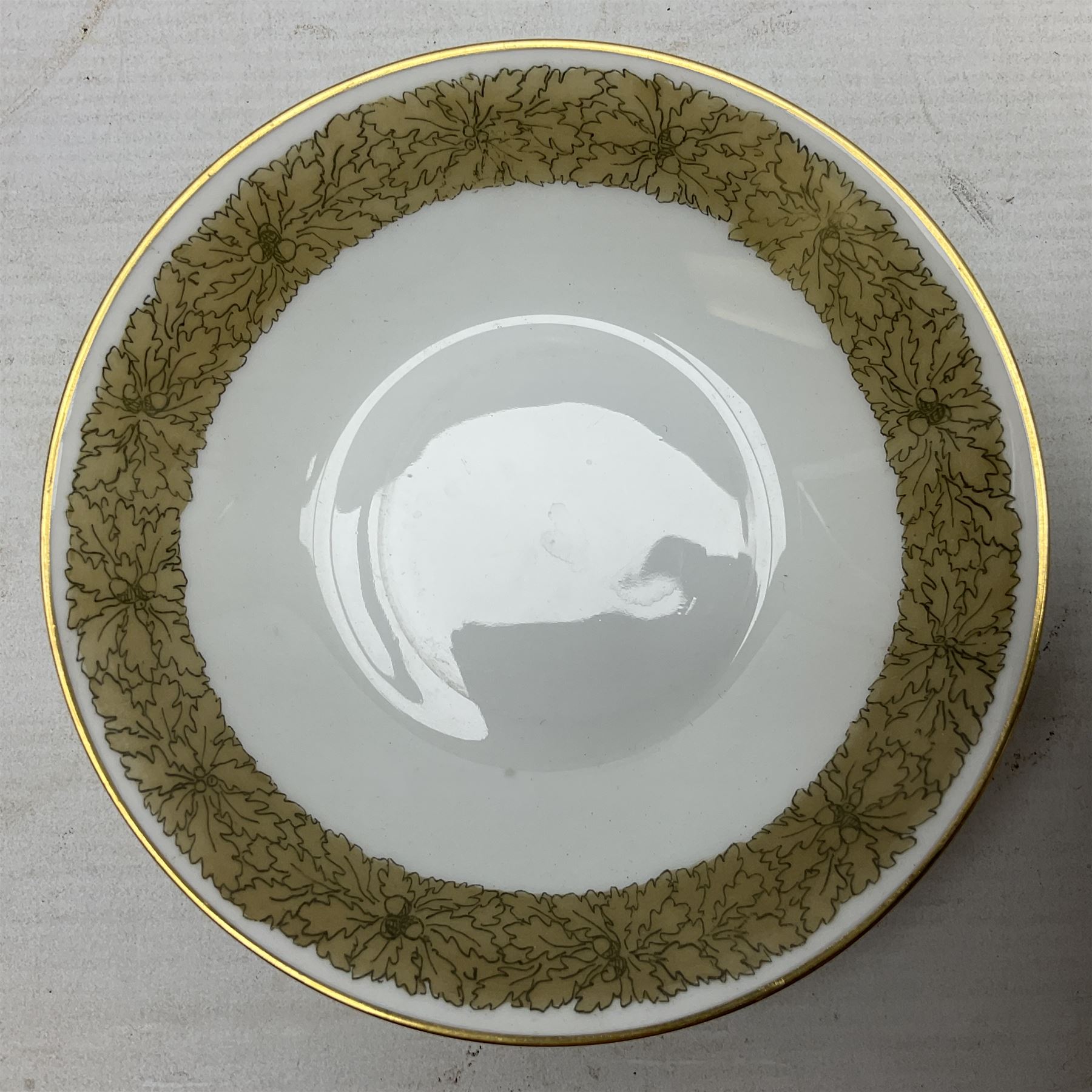 WW2 Nymphenburg cups and saucer, decorated with Imperial German Iron Cross encircled in a foliate boarder with gilt edging, with printed mark beneath 