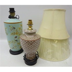  Oriental style ceramic table lamp of cylindrical tapered form decorated with birds amongst foliage, H33cm and an Eastern style ceramic table lamp, both with shades, as new (2)  