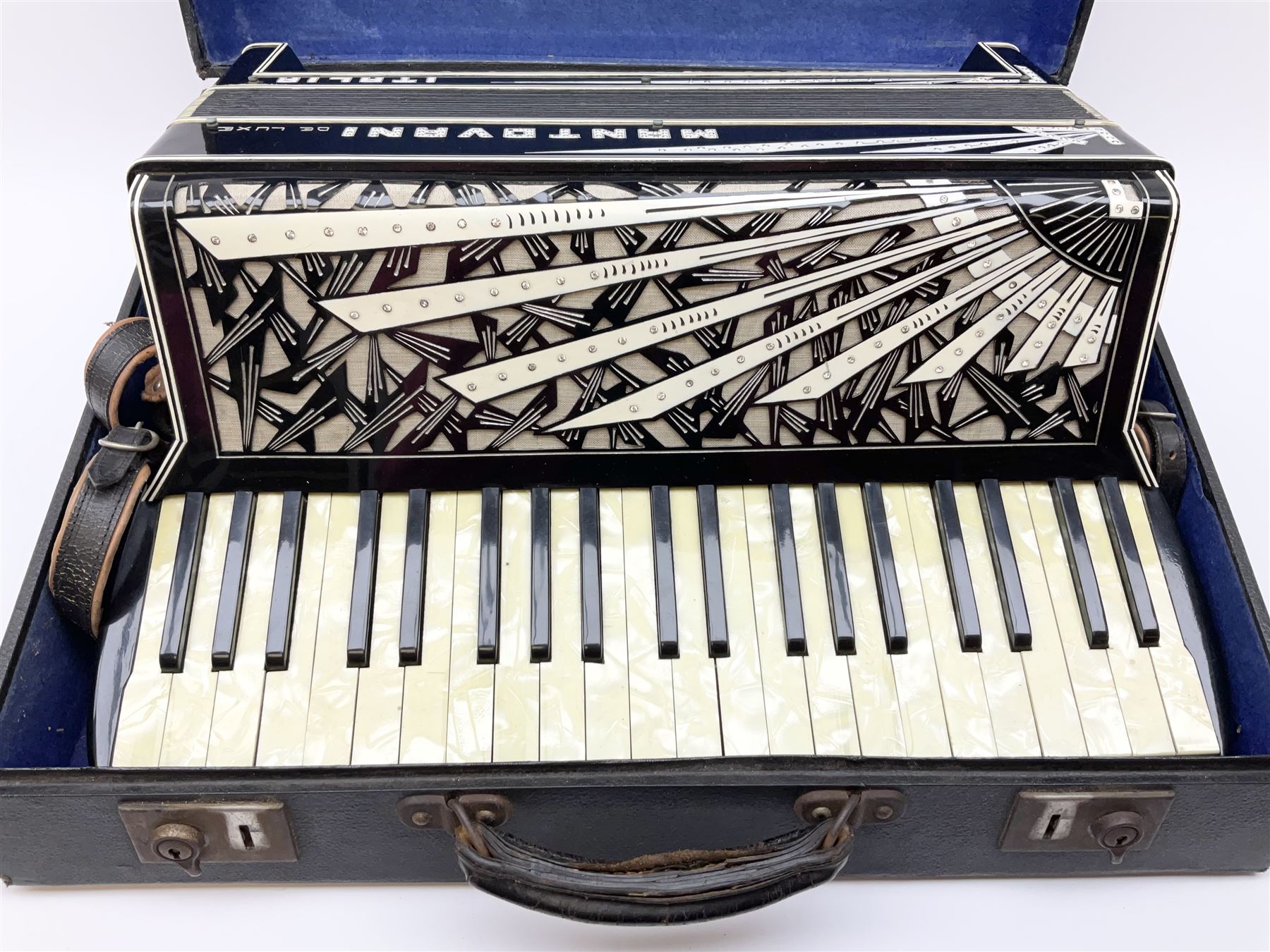 Italian Mantovani piano accordion with Art Deco style black and white case, twenty-four keys and one-hundred and twenty buttons L52cm in carrying case