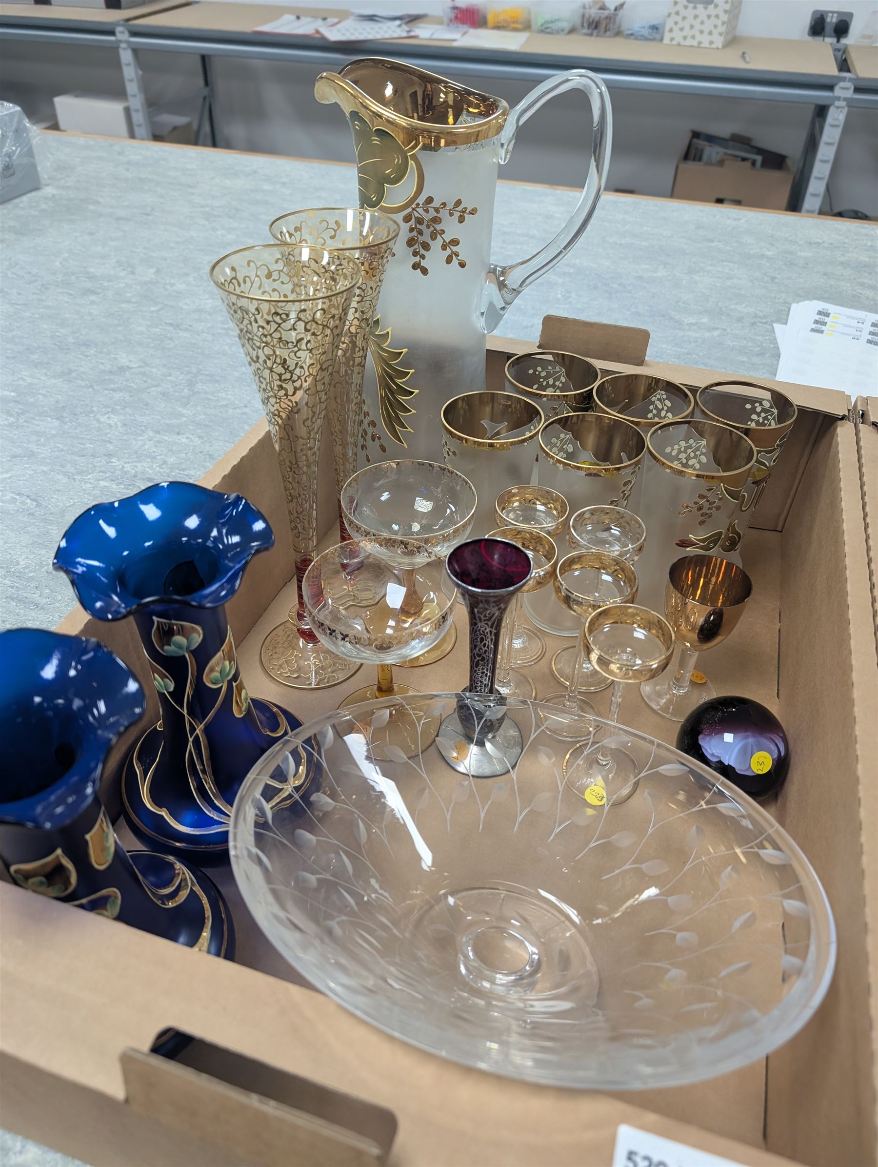 Collection of assorted glassware, to include Czech hand painted lemonade set, with tall jug and six glasses, pair of Art Nouveau blue glass vases painted in gilt with foliate tendrils, John Walsh style bowl with cut leaves decoration, various Edwardian drinking glasses with cut and etched decoration, etc., in two boxes