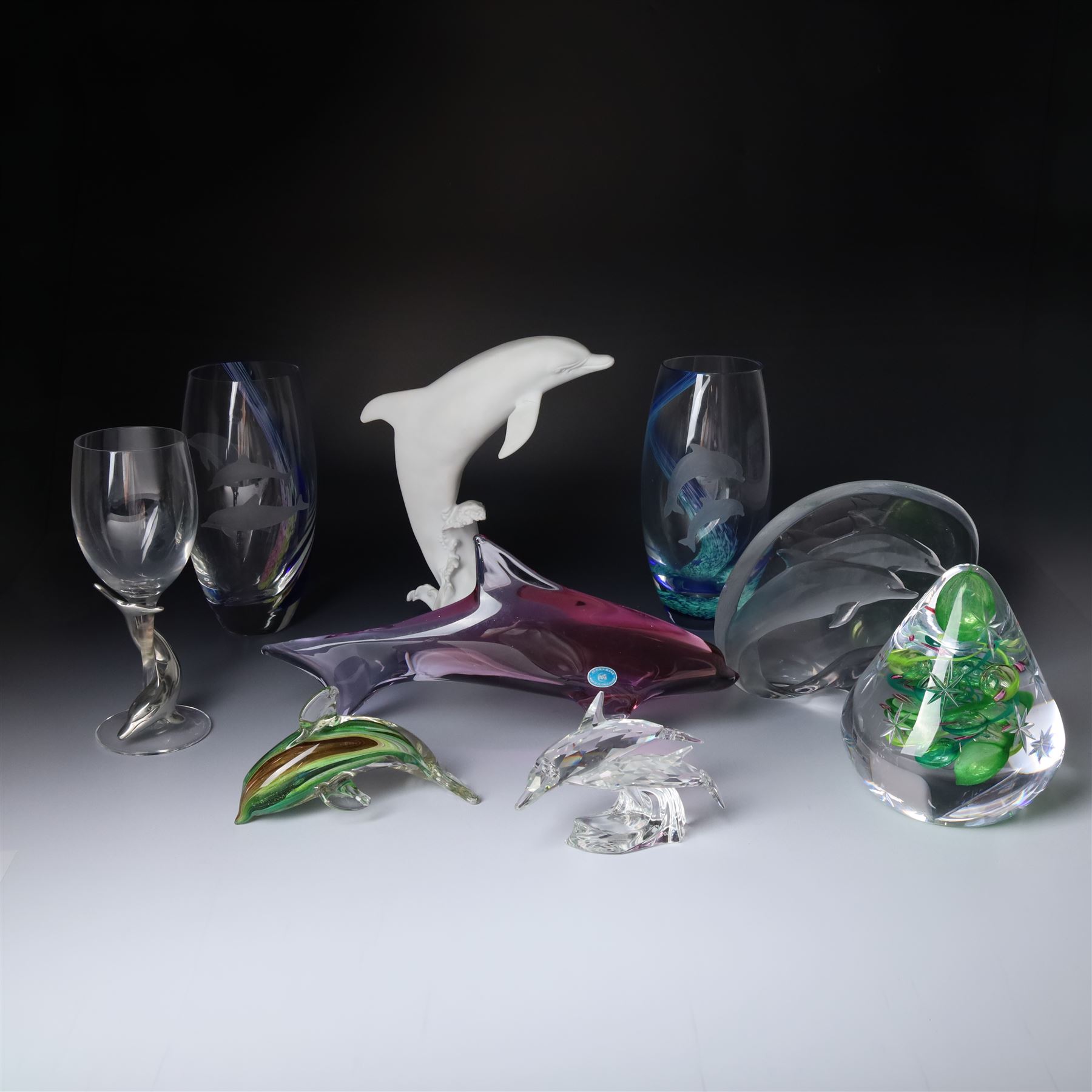 Glassware including Mats Jonasson Signature Collection dolphin sculpture, Swarovski 1990 Annual Edition dolphin model 'Lead Me', two Caithness vases, Caithness 'Christmas Tree' paperweight, Bohemia glass large dolphin model and wine glass with etched decoration, six boxed