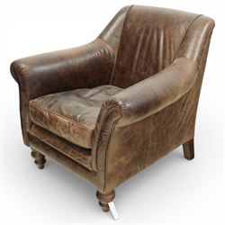 Tetrad - late 20th century leather armchair, upholstered in brown leather with a gently curved back and rolled arms, loose seat cushion over a padded base, raised on turned wooden feet