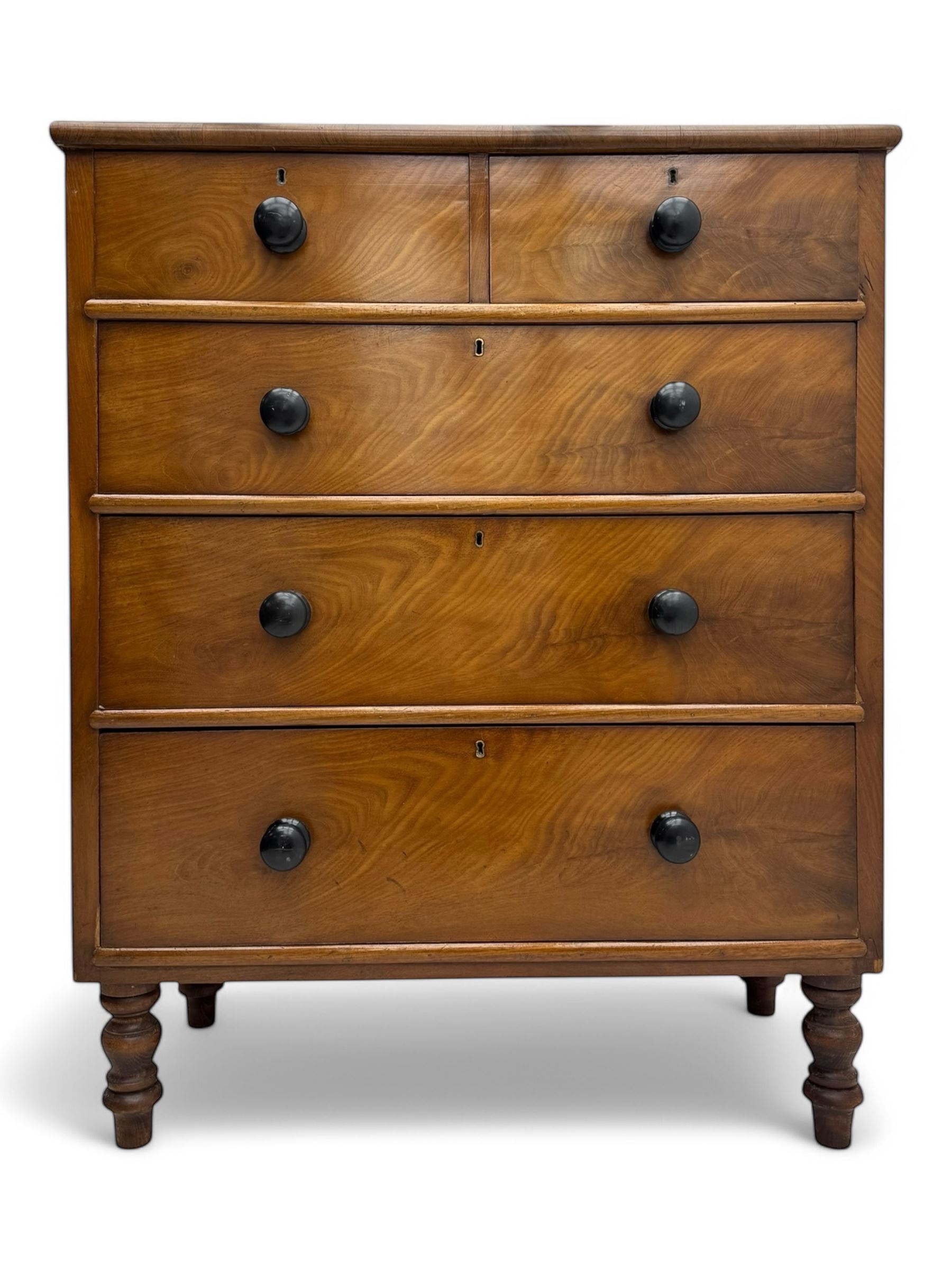 Late Victorian mahogany chest of drawers, with rectangular top over two short and three long graduated drawers, each fitted with ebonised turned knob handles and keyholes, raised on turned supports