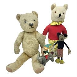 Deans Rag Book Mickey Mouse soft toy, circa 1930's, black velveteen head and body, with cream face and hands, red shorts and yellow felt shoes with leather soles, marked Reg. No. 750811 to neck H20cm; mid-20th century woodwool filled plush covered teddy bear with revolving head, applied eyes, vertically stitched nose and mouth and jointed limbs H52cm; soft toy figure of Rupert Bear; and Japanese clockwork tin-plate and plush covered mechanical toy of a gnome riding a donkey (4)