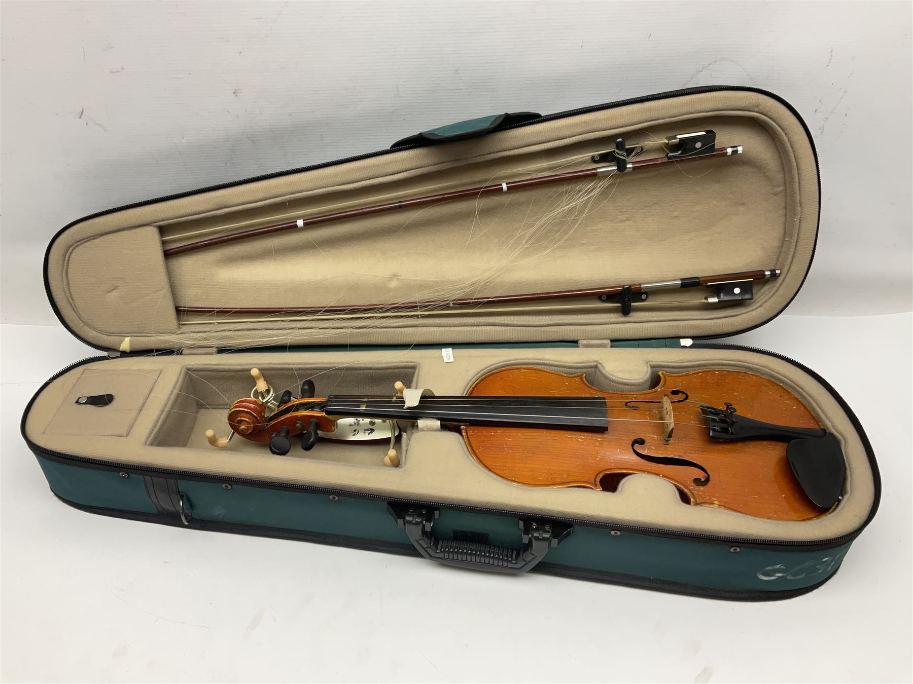 Two three-quarter size violins - German Saxony with 34cm one-piece maple back and ribs and spruce top; L56cm overall; and Hungarian with 34cm two-piece maple back and ribs and spruce top; L56cm overall; each in carrying case with bow (2)
