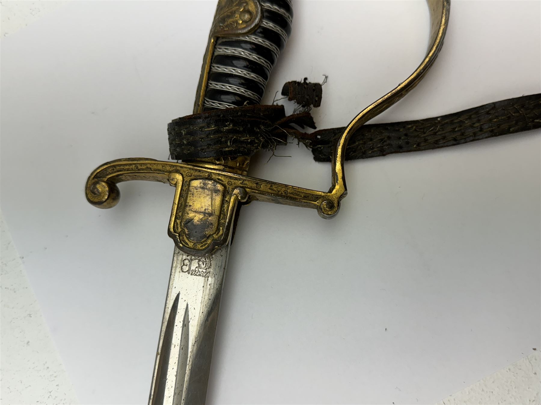 German infantry dress sword, dove head stirrup handle with black wire-bound grip cast cross guard with German eagle set into the langet, the curved 81cm single edge blade with single fuller marked Elckhorn Solingen, L93cm overall