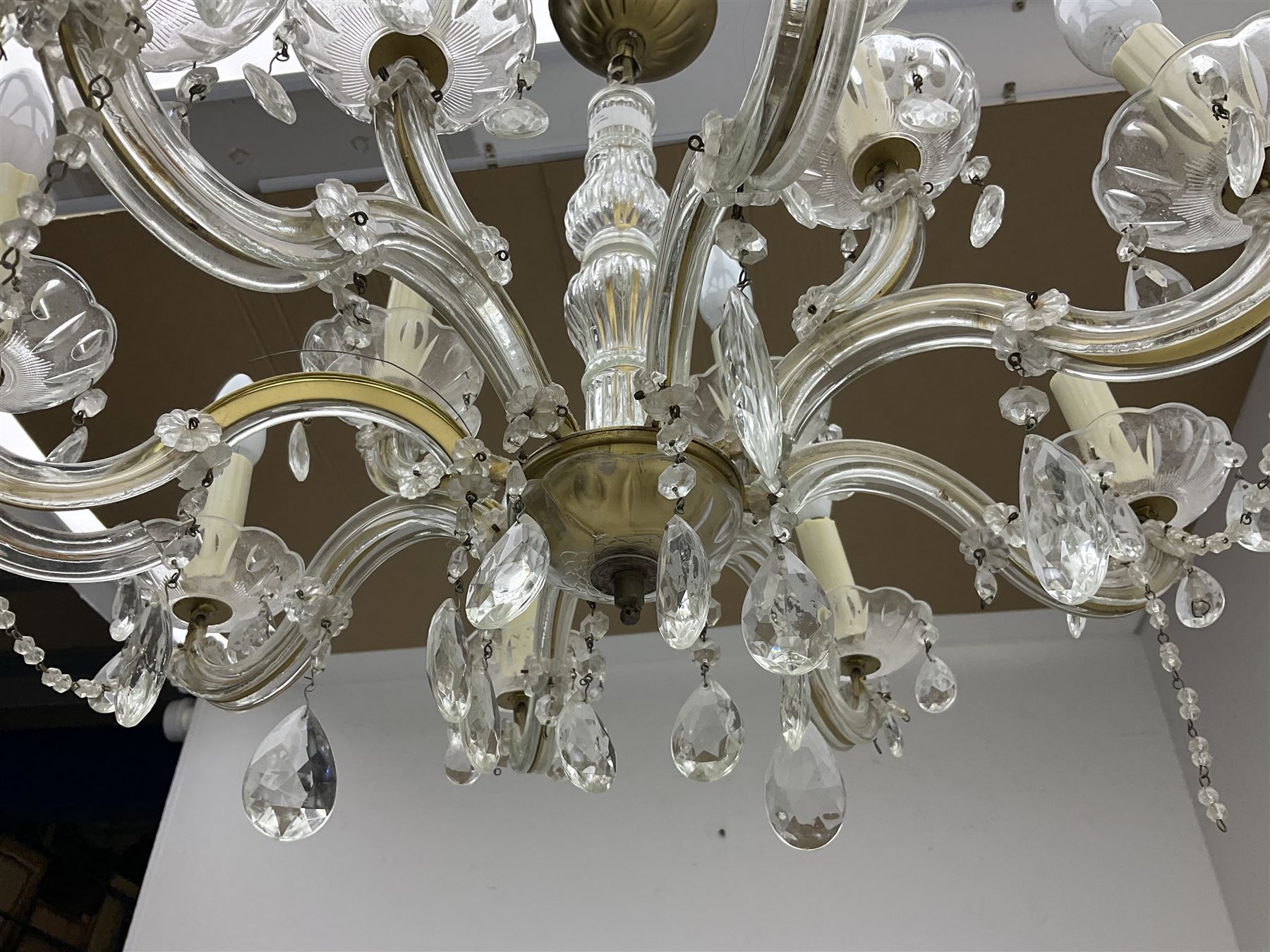 Victorian style glass eight branch chandelier, with drip trays, brass tone support, and drops