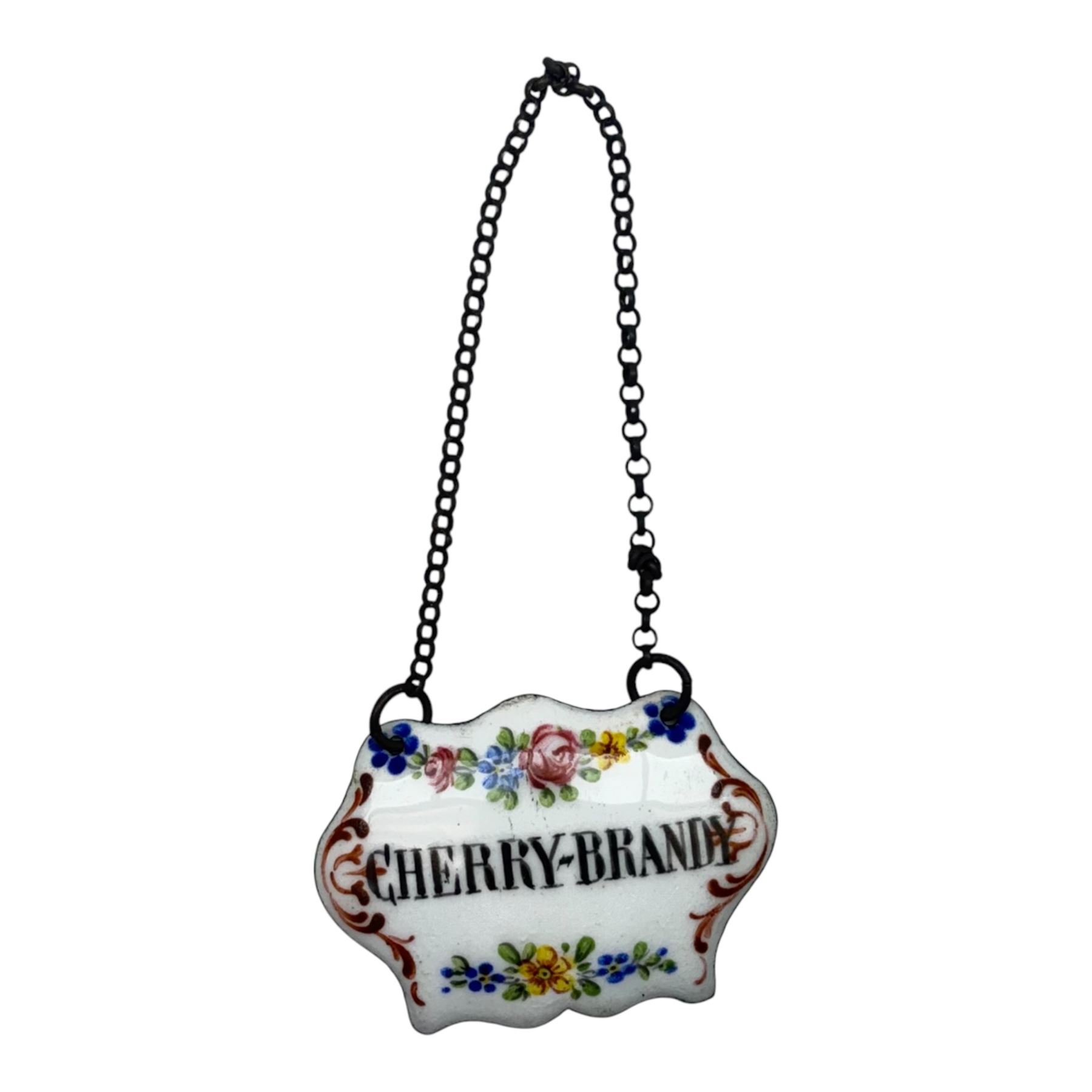 Seventeen mid 18th century and later enamel wine labels, one example of heart shaped form, the rest of cartouche and escutcheon form, various titles including Claret, Rum, Sloe Gin, Port, Whisky, Cowslip, Cherry-Brandy, etc., largest example W7cm 