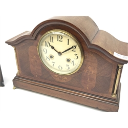 *Early 20th century mahogany mantel clock, shaped moulded top over circular Arabic dial, the front inlaid with ribbons and husks and flanked by turned brass columns, stepped moulded base with out splayed brass feet, twin train movement striking the hours and half on coil (W39cm, H28cm, D13cm (with key and pendulum)), and an early 20th century oak case mantel clock (with key)