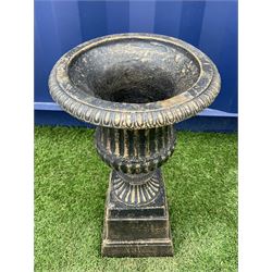 Cast iron Campana shaped urn on plinth, the rim decorated with egg and dart moulding, waisted lobed body with gadrooned underside, square tapered plinth  - THIS LOT IS TO BE COLLECTED BY APPOINTMENT FROM DUGGLEBY STORAGE, GREAT HILL, EASTFIELD, SCARBOROUGH, YO11 3TX