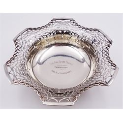 1920's silver footed bowl, with shaped and pierced rim, the centre with personal engraving, upon a circular spreading foot, hallmarked Walker & Hall, Sheffield 1928, H7cm D22.5cm approximate weight 14.20 ozt (441.7 grams)